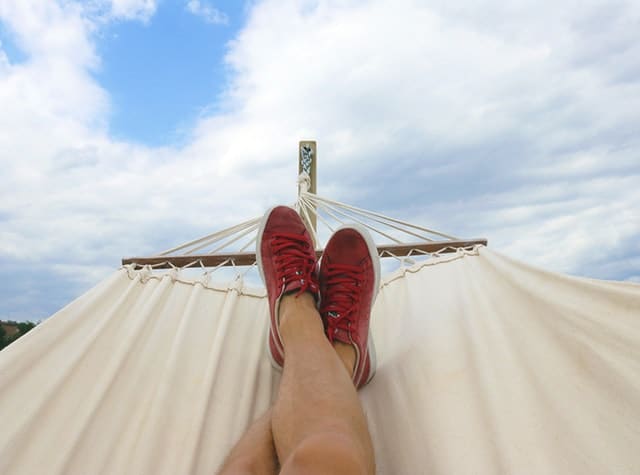 person's feet in a hammock 