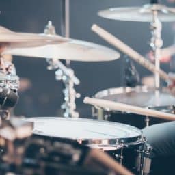 Close up of a musician playing drums.