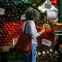 Woman shopping at an outdoor market.